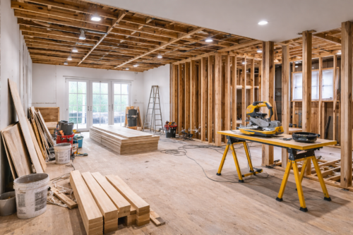 construction site contracting professionals using equipment with business liability insurance concept